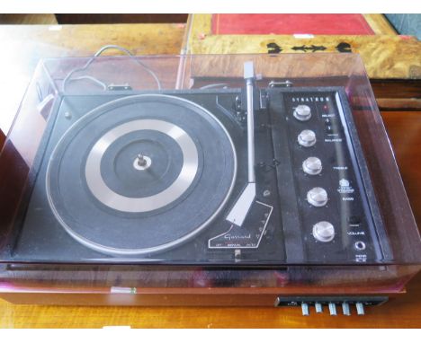 A Dynatron record player with in built radio and twin speakers. 