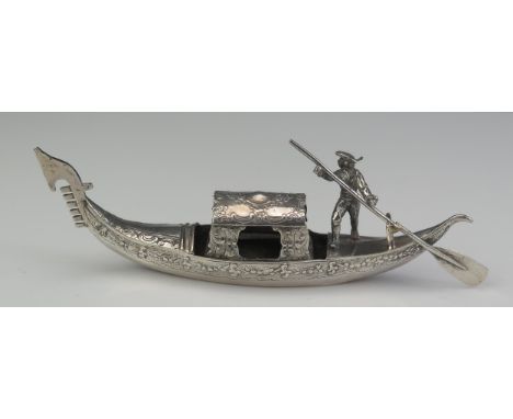 A Continental silver model of a Venetian gondola, with banded floral decoration and gondolier figure, 15,5cm long, 69gms, 2.2
