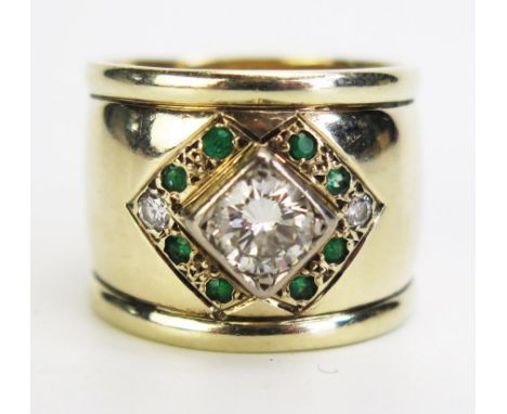 A 9ct Gold, Diamond and Emerald dress Ring, 16mm wide shank, size P, c. 10.3g. Sold together with Ascot Jewellers Insurance V