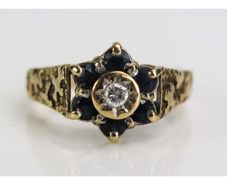 A 9ct Gold, Sapphire and Diamond Cluster Ring, 11mm head, size N.5, 3.4g 