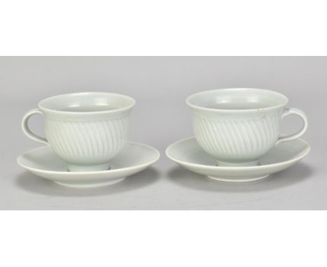 DAVID LEACH (1911-2005) for Lowerdown Pottery; a pair of fluted porcelain cups and saucers covered in celadon glaze, impresse