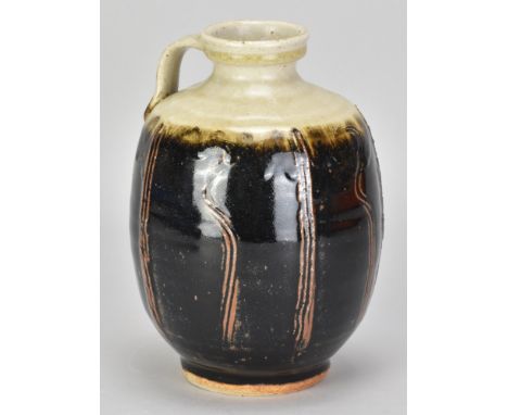 JIM MALONE (born 1946); a stoneware bottle with side handle partially covered in tenmoku breaking to kaki glaze with incised 