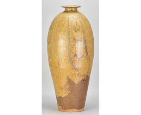 JIM MALONE (born 1946); a very tall stoneware bottle covered in ash and granite glaze over ochre slip with incised decoration