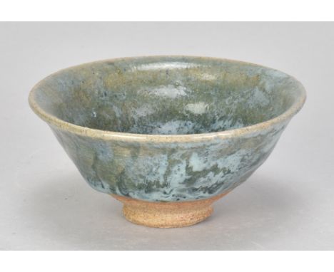 KATHARINE PLEYDELL-BOUVERIE (1895-1985); a small stoneware bowl partially covered in green and patches of blue/grey ash glaze