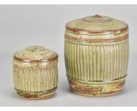 RICHARD BATTERHAM (1936-2021); a fluted stoneware caddy covered in green ash glaze, height 17.5cm, and a smaller example, hei