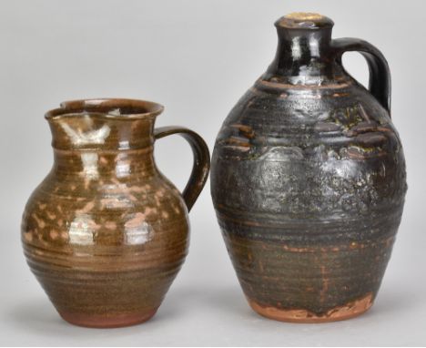 SIDNEY TUSTIN (1914-2005) for Winchcombe Pottery; an early slipware flagon covered in black glaze, impressed ST and pottery m