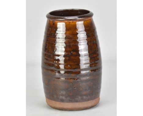 Leach Pottery; an early slipware jar with pronounced ribbing covered in treacle glaze, impressed pottery mark, height 18.5cm.