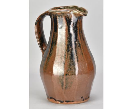 JIM MALONE (born 1946); a fluted stoneware pitcher covered in tenmoku and kaki glaze with green ash rim, impressed JM and A (