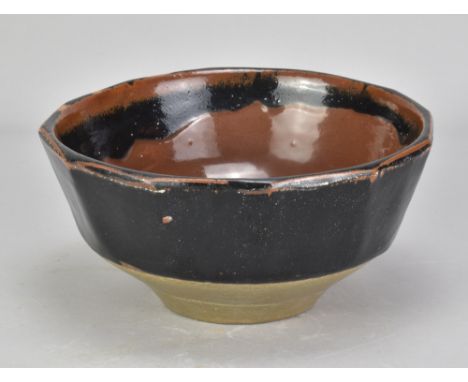 BERNARD LEACH (1887-1979) for Leach Pottery; a cut sided stoneware bowl partially covered in tenmoku and kaki glaze, impresse