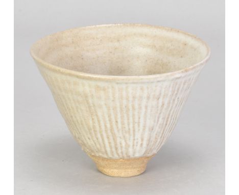 KATHARINE PLEYDELL-BOUVERIE (1895-1985); a fluted stoneware bowl covered in white ash glaze, impressed KPB mark and painted c