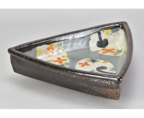 JOHN MALTBY (1936-2020); a triangular footed dish decorated with stylised flowers, painted signature, diameter 31cm. (D)Addit