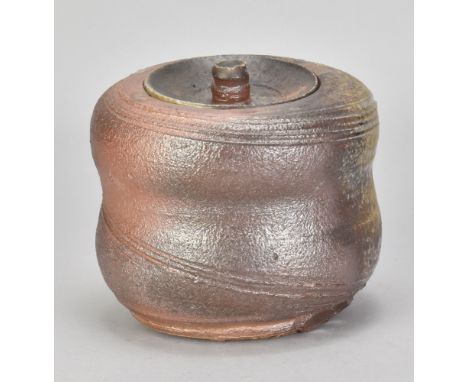 PASCAL GEOFFROY (born 1951); a wood fired stoneware caddy partially covered in green ash glaze with incised spiralling decora
