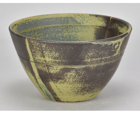 ROBIN WELCH (1936-2019); a stoneware bowl covered in green and mottled iron glaze with a streak of cobalt, impressed mark, di