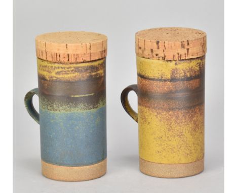 ROBIN WELCH (1936-2019); a pair of stoneware mugs with cork covers, impressed marks, height 15.5cm (including covers) (2). (D