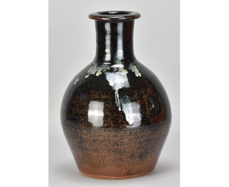 JIM MALONE (born 1946); a stoneware bottle covered in tenmoku breaking to kaki glaze with copper green pours, impressed JM an