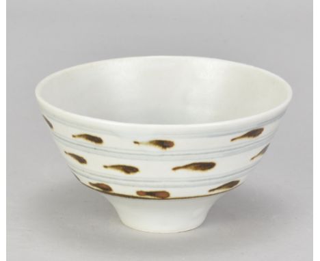 DAVID LEACH (1911-2005) for Lowerdown Pottery; a small porcelain bowl covered in celadon glaze with iron and cobalt decoratio