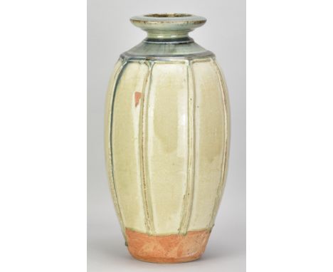 RICHARD BATTERHAM (1936-2021); a tall ribbed stoneware bottle covered in green ash glaze with cobalt tinted top, height 41.5c