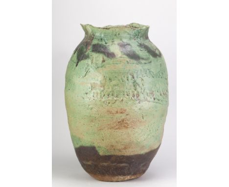 EWEN HENDERSON (1934-2000); a large stoneware sack form with textured surface covered in green glaze and iron staining, heigh