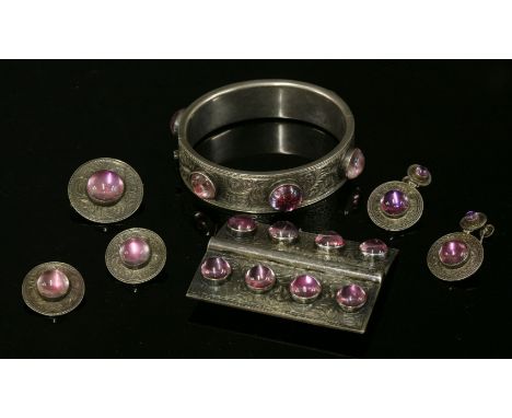 A Victorian foiled quartz bangle, buckle, brooches and earrings suite, c.1880,the flat section hinged bangle with a series of