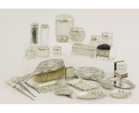 A collection of twenty-one silver dressing table items,various dates and makers, Birmingham, 1897-1913,chased after Reynolds 