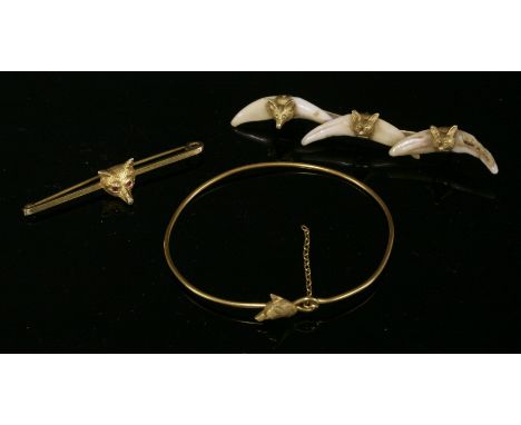 A collection of three gold fox head items of jewellery,to include a gold sprung wire and fox head bangle with a hook clasp, a