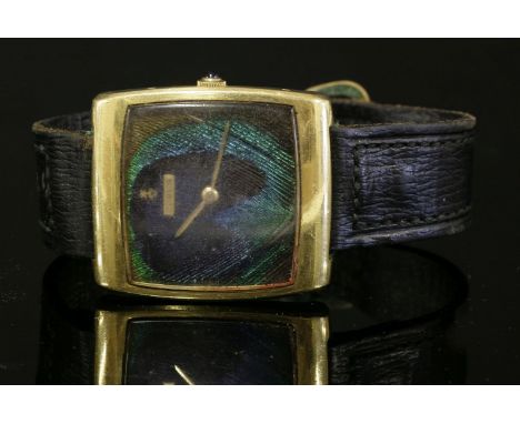 A gentlemen's 18ct gold Corum Buckingham mechanical strap watch, c.1970,a cushion-shaped case with a peacock feather cushion-