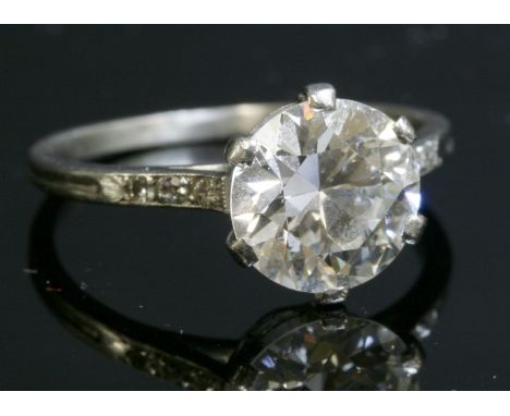 A single stone diamond ring, c.1930,with diamond set shoulders.  An old brilliant cut diamond, estimated as approximately 2.0