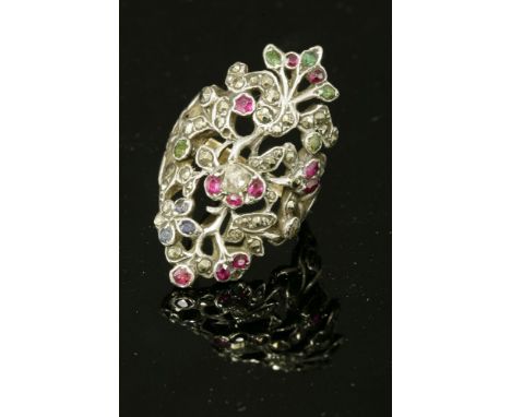 A diamond, ruby, emerald, sapphire and marcasite giardinetti ring,with a rose cut diamond and ruby flower head cluster to the