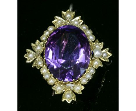 A late Victorian amethyst, seed pearl and split pearl brooch/pendant, c.1900,an oval mixed cut amethyst, claw set to the cent