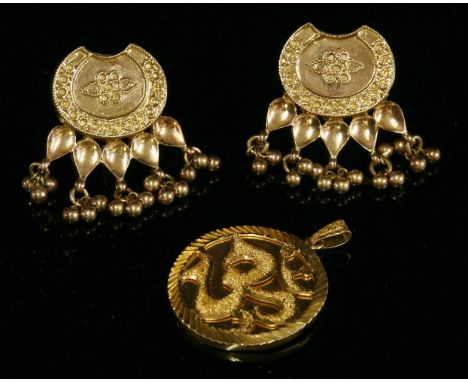 A pair of Indian high carat gold drop earrings,with an oval plaque top, decorated with twisted wire scrolls, a fan shape of p