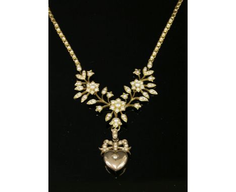 A late Victorian gold and split pearl necklace, c.1900the necklace with an articulated spray centrepiece with flower head clu