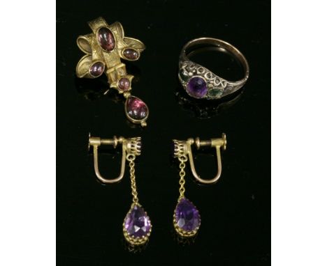 A pair of gold and amethyst drop earrings, c.1900,with a circular mixed cut amethyst, claw set at the top, a section of trace