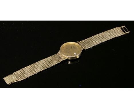 A gentlemen's 9ct gold Solvil et Titus watch quartz bracelet watch, c.1990,with a circular champagne raised baton dial, gilt 
