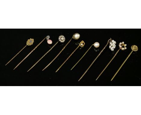 A collection of nine Victorian and Edwardian stickpins,including one late 20th century example.  A Victorian diamond and conc