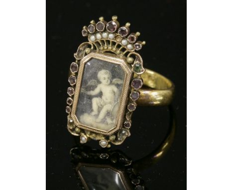 A Georgian two-colour gold gem set painted miniature,later mounted to a 22ct gold wedding ring.  A rectangular cut corner pai