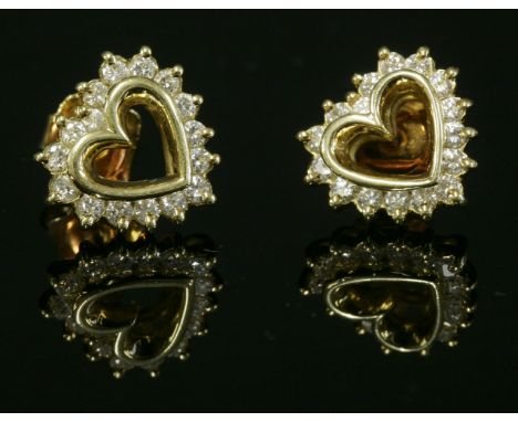 A pair of gold diamond set heart-shaped stud earrings,with a row of brilliant cut diamonds, claw set to an interior heart-sha