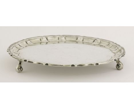 An Edward VII silver salver,William Hutton & Sons Ltd., London, 1909,plain with shaped moulded border on three scroll feet, s