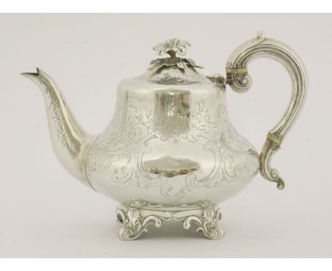 A Victorian silver teapot, Richard Pearce & George Burrows, London, 1845,of bombe form, engraved overall with 'C' scrolls and