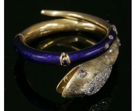 A Victorian diamond and enamel articulated snake bangle,hollow elliptical section with the body and tapering tail with royal 