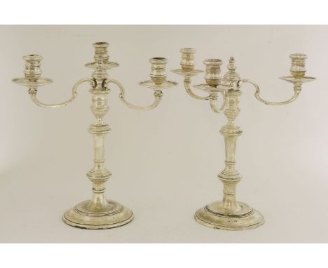A pair of Elizabeth II silver three-light candelabrum,Richard Comyns, London,  bases 1960, branches 1964,the baluster stems o