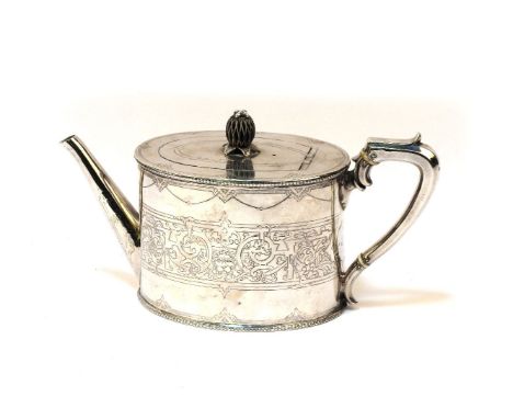 A Victorian silver teapot,Daniel and Charles Houle, London, 1872, oval body engraved with a lion's head and strapwork termina