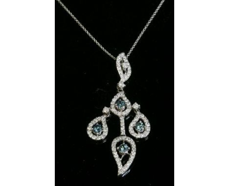 An American white gold diamond set pendant,with treated blue diamonds and natural diamonds.  Four articulated open leaf shape
