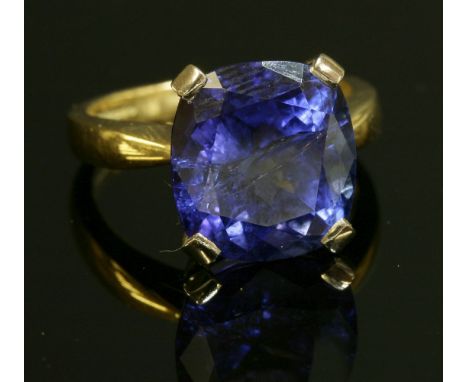 An 18ct gold single stone tanzanite ring,with a cushion cut tanzanite, reputed to weigh approximately 10.00ct, four claw set 