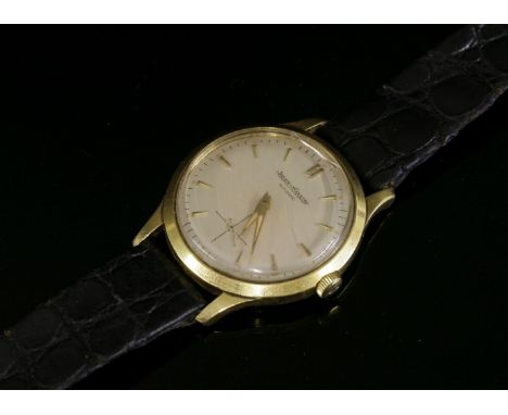 A gentlemen's 18ct gold Jaeger LeCoultre Automatic strap watch, possibly c.1950,the case 33mm diameter, with a circular silve