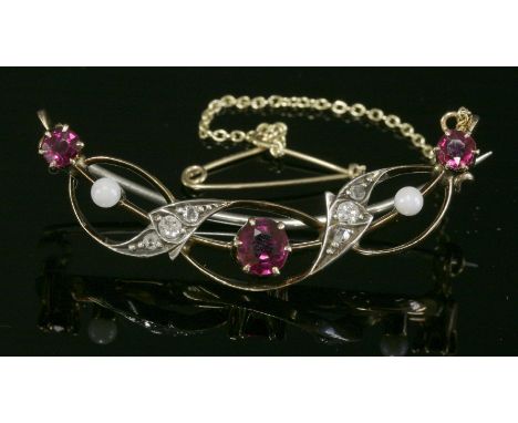 A late Victorian ruby, diamond and cultured pearl open crescent brooch, c.1890,of ribbon form.  A blade edge bar crescent wit