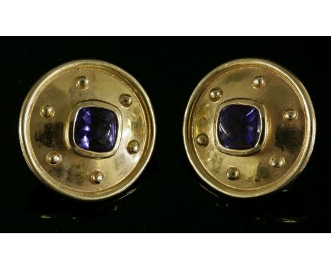 A pair of 18ct gold tanzanite earrings, c.1995,by Cedric Jones, of circular shield form with a cushion-shaped buff top tanzan