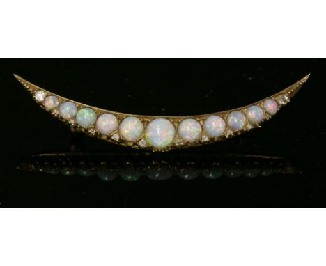 A Victorian gold, opal and diamond set open crescent brooch, c.1890,a row of graduated, circular, cabochon opals, with an old