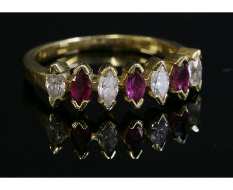 A gold, ruby and diamond half eternity ring,with a row of alternating marquise cut diamonds and rubies, all chevron set at th