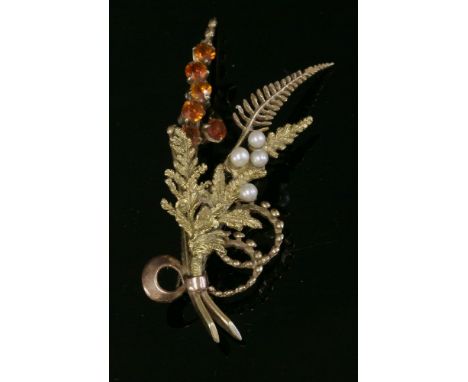 A 9ct two-colour gold citrine and cultured pearl spray brooch, c.1960,by Alabaster & Wilson.  A spray of assorted ferns with 