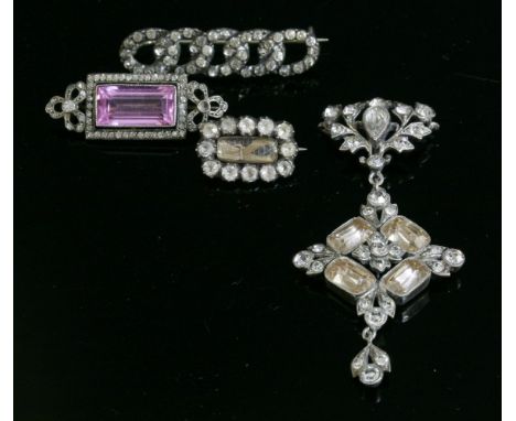 A silver paste pendant, 19th century,with a central cluster of topaz coloured scissor cut paste, set to dome back collets, wi